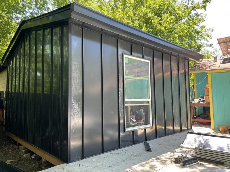 Black standing seam metal wall panels for Roof Inspection in Tillmans Corner